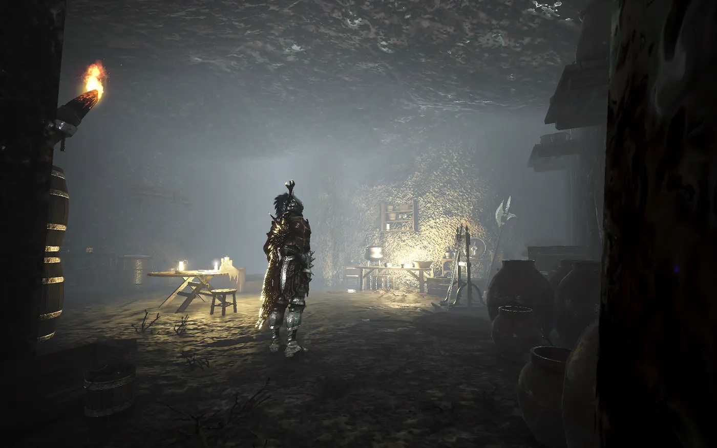 An armoured adventurer stands in a dim torchlit cave camp with tables and weapon racks